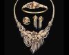 <span class='ref_item'>84 -</span> <span class="object_title">ELEGANTE ADEREZO DE ORO 18KT, DIAMANTES Y ZAFIROS</span>  <p><span class="technical_description">Aderezo formado por gargantilla, pulsera, sortija y pendientes, realizados en oro de 18kt con diseños florales y vegetales.<br/>Todos ellos adornados con diamantes en talla brillante con peso total aprox 12ct los la gargantilla, 2ct la pulsera, 1ct sortija y 5ct pendientes) con color H-I y pureza SI1-SI2. <br/>Peso aprox de todos los diamantes: 20ct<br/>También adornados por zafiros en talla baguette y perilla con peso total aprox 20ct<br/>Se acompaña de certificado de la gargantilla del Instituto Gemológico de Madrid nº 436.<br/>Cierre: Omega los pendientes, bisagra con ocho de seguridad la pulsera, mosquetón la gargantilla <br/>Medida Sortija: 13</span><br>Peso: <span class="PESO_HCES1">130</span> <span class="PESOUMED_HCES1">gr.</span><br></p>
