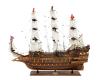 <span class='ref_item'>154 -</span> <span class="description">REPRODUCCIÓN BARCO INGLÉS SOVEREIGN OF THE SEAS </span>  <p><span class="description">Reproducción del buque de guerra inglés Sovereign of the seas, un gran navío de la armada inglesa del siglo XVII, realizado en madera tallada y policromada. Con cuatro banderas y velas en tejido. <br>La maqueta descansa sobre una base rectangular de madera con una placa dorada.<br>Falta un cañón en la parte trasera. Pequeño desperfecto en el bouprés frontal.<br>Medidas: 82cm x 93cm x 17cm.</span></p>