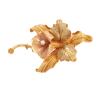 <span class='ref_item'>38 -</span> <span class="object_title">BROCHE VINTAGE EN FORMA DE ORQUIDEA EN ORO DE 18 KT Y PERLA CULTIVADA</span>  <p><span class="technical_description">Broche con forma de orquídea, diseño habitual en joyería antigua, realizado en oro de 18 kt, con acabados en brillo y mate. Adorno de perla cultivada.<br/>Cierre: Aguja con mecanismo de seguridad.</span><br>Peso: <span class="PESO_HCES1">11,60</span> <span class="PESOUMED_HCES1">gr.</span><br></p>