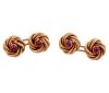 <span class='ref_item'>35 -</span> <span class="object_title">GEMELOS DE DOBLE BOTÓN EN ORO DE 18 KT.CON RUBIES SÍNTETICOS</span>  <p><span class="technical_description">Par de gemelos con doble botón realizados en oro de 18 kt. con diseño circular de nudos y en el centro rubíes sintéticos</span><br>Peso: <span class="PESO_HCES1">8,50</span> <span class="PESOUMED_HCES1">gr.</span><br></p>
