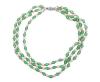 <span class='ref_item'>48 -</span> <span class="object_title">COLLAR FANTASIA ,CON PERLAS CULTIVADAS Y CRISTALES VERDES. CIERRE METAL</span>  <p><span class="technical_description">Collar fantasía compuesto por tres hilos alternando perlas cultivadas color blanco calibradas aprx(6,5 mm) con cristales facetados en color verde brillante. Lleva aplicaciones y broche en metal este último adornado por piedra verdes. Deterioros en hilos de la parte superior<br/>Cierre: Caja con lengüeta<br/>Peso: 88 gr</span><br></p>