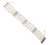 <span class='ref_item'>25 -</span> <span class="object_title">PULSERA BRAZALETE  DE  TRES HILOS DE PERLAS CULTIVADAS, ORO DE 687/MM Y DIAMANTES</span>  <p><span class="technical_description">Pulsera brazalete estilo vintage compuesta por tres hilos de perlas cultivadas calibradas aprox( 7,5mm) ,con separadores y broche realizados en oro de 687/mm adornados por diamantes en talla brillante con peso total aprox(1.40 ct)<br/>Cierre de pasador y cadena de seguridad. Medidas: 18 cm longitud y 2 cm ancho </span><br>Peso: <span class="PESO_HCES1">51,60</span> <span class="PESOUMED_HCES1">gr.</span><br></p>