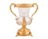 <span class='ref_item'>135 -</span> <span class="object_title">JARRÓN EN CRISTAL TALLADO Y BRONCE DORADO</span>   <p><span class="technical_description">Jarrón realizado en cristal de plomo de alta calidad tallado. Con monturas, asas y base en bronce dorado con baño de oro (ormolú) de estilo Napoleón III con elaborados detalles cincelados en forma de hojas. Con sello en su interior que certifica que se trata de cristal de plomo de alta calidad.<br/>Peso bruto total: 2836.6gr<br/>Medidas: 29.5cm altura</span><br></p>