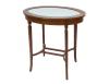 <span class='ref_item'>210 -</span> <span class="object_title">MESA AUXILIAR EN MADERA DE CAOBA</span>   <p><span class="technical_description">Mesa auxiliar realizada en madera de caoba estilo eduardiano con marquetería y tapa ovalada de cristal. Bajo el cristal tapizado en tono beige con decoración de motivos florales. Medidas: 76cm x 75.5cm x 52.5cm</span><br></p>