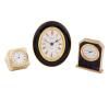 <span class='ref_item'>142 -</span> <span class="object_title">LOTE DE TRES RELOJES METÁLICOS DE CUARZO</span>   <p><span class="technical_description">- Reloj de mesa decorativo en metal dorado con esfera blanca y números romanos con diseño trapezoidal. Medidas: 4.5cm x 4cm x 6.5cm<br/>- Reloj de mesa marca Egaler fabricado en Alemania Occidental. Realizado con un diseño ovalado. El reloj cuenta con un marco negro lacado, un bisel interior y exterior dorado y una esfera blanca con números romanos. Medidas: 9 x 8 x 4cm<br/>- Reloj de sobremesa marca Junghans realizado en metal dorado. El cuerpo del reloj presenta un diseño marmoleado morado. Esfera blanca con númeración romana. Medidas: 6.8cm x 5.5cm x 1.6cm</span><br></p>
