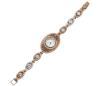 <span class='ref_item'>14 -</span> <span class="object_title">RELOJ  DE BRONCE Y PLATA DE LEY 925.CON ADORNO DE PIEDRAS AZULES Y BLANCAS. QUARZO</span>  <p><span class="technical_description">Reloj realizado en bronce y plata de ley 925, tanto la caja como el brazalete. Caja de forma oval calada en filigrana adornada por piedras azules y por piedras blancas en los contornos ( faltan algunas de ellas). Esfera redonda con fondo beige nacarado y números arábigos en las 12 , 3 , 6 y 9, con orla de piedras blancas, medida aprox. de la caja: 4 cm x 2,5 cm<br/>Brazalete formado por eslabones ovales con piedra central y orlas en blanco<br/>Cierre de pestaña grande. Longitud: 17 cm. Sistema de mecanismo de cuarzo. En estado de marcha</span><br>Peso: <span class="PESO_HCES1">39,7</span> <span class="PESOUMED_HCES1">gr.</span><br></p>