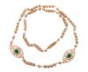 <span class='ref_item'>105 -</span> <span class="object_title">GRAN COLLAR EN METAL DORADO CON FILIGRANA  Y PIEDRAS VERDES Y BLANCAS</span>  <p><span class="technical_description">Gran collar, realizado en metal dorado compuesto por cuentas esféricas caladas , otras lisas y cilíndricas caladas en filigrana, detalle en la parte central de dos escudos grandes ovales calados en filigrana y adornados por piedras de color verde y blanco<br/>Longitud: 100,10 cm</span><br>Peso: <span class="PESO_HCES1">118,20</span> <span class="PESOUMED_HCES1">gr.</span><br></p>