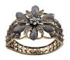 <span class='ref_item'>114 -</span> <span class="object_title">BRAZALETE EN METAL DORADO OSCURO, CALADO Y ADORNADO POR PIEDRAS GRISES LAS DEL MOTIVO CENTRAL CON TERMINACIÓN MARMOLEA</span>  <p><span class="technical_description">Brazalete realizado en metal dorado oscuro , todo él calado y adornado en su parte central por un motivo de gran flor formada por piedras grises de terminación marmolea en forma de pétalos y por otras trasparentes con tonos agrisados. Bisagra y cierre de presión. Medidas: En su parte más ancha: 5 cm. Ovalo interior: 6 cm<br/> </span><br>Peso: <span class="PESO_HCES1">67</span> <span class="PESOUMED_HCES1">gr.</span><br></p>