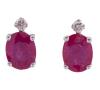 <span class='ref_item'>155 -</span> <span class="object_title">PENDIENTES EN ORO DE 18 KT. CON RUBÍES Y DIAMANTES</span>  <p><span class="technical_description">Pareja de pendientes realizados en oro de 18 kt. dormilonas, compuestos por rubíes centrales en talla oval engastados en garra con peso total aprox. 1.ct y detalle superior de diamantes en talla brillante con peso total aprox. 0.05 ct. <br/>Cierre: Presiones de silicona</span><br>Peso: <span class="PESO_HCES1">0,8</span> <span class="PESOUMED_HCES1">gr.</span><br></p>