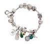 <span class='ref_item'>123 -</span> <span class="object_title">PULSERA "PANDORA" CON MÚLTIPLES DIJES  TODO EN PLATA DE LEY 925</span>  <p><span class="technical_description">Pulsera "PANDORA" y múltiples dijes todo ello realizado en plata de ley 925.<br/>La pulsera con diseño articulado y flexible terminado como escama de serpiente<br/>Lleva diecisiete dijes con diferentes motivos en plata, uno de ellos con esmalte y otro con esmalte y adorno de piedras verdes. (Señales de uso). En su caja original<br/>Cierre: Cilíndrico de barril con mecanismo de apertura<br/>Longitud: 17 cm</span><br>Peso: <span class="PESO_HCES1">60</span> <span class="PESOUMED_HCES1">gr.</span><br></p>