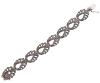 <span class='ref_item'>173 -</span> <span class="object_title">PULSERA VINTAGE EN PLATA DE LEY 925 DE INSPIRACIÓN ART DÉCO Y ADORNO DE MARCASITAS</span>  <p><span class="technical_description">Pulsera vintage realizada en plata de ley 925, con diseño de inspiración Art Decó, articulada compuesta por eslabones simétricos en forma de roleos o motivos florales decorados con marcasitas. ( Señales de uso)<br/>Cierre: Caja con lengüeta y ocho de seguridad<br/>Medidas: Longitud 17 cm, ancho 1,8 cm</span><br>Peso: <span class="PESO_HCES1">32,20</span> <span class="PESOUMED_HCES1">gr.</span><br></p>