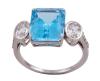 <span class='ref_item'>148 -</span> <span class="object_title">SORTIJA EN ORO DE 9 KT. CON TOPACIO SWISS BLUE , ZAFIROS FANCY Y DIAMANTES. JOYA EXCLUSIVA MODERNA</span>  <p><span class="technical_description">Sortija realizada en oro de 9 kt. con gran topacio SWISS BLUE en talla rectangular engastado en garra con peso aprox. 7.15 ct. flanqueado a los lados por zafiros fancy en talla oval engastados en bisel con peso total aprox. 1.1 ct y adorno de bandas de diamantes en talla brillante con peso total aprox. 0.05 ct.<br/>Ref: 1378<br/>Medida sortija: 14</span><br>Peso: <span class="PESO_HCES1">4</span> <span class="PESOUMED_HCES1">gr.</span><br></p>