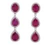 <span class='ref_item'>26 -</span> <span class="object_title">PENDIENTES EN ORO DE 18 KT. CON RUBÍES Y DIAMANTES</span>  <p><span class="technical_description">Pareja de pendientes realizados en oro de 18 kt. Largos, compuestos por rubíes en tallas ovales y perillas engastadas en garras con peso total aprox.15.50 ct, y adorno de diamantes en talla brillante con peso total aprox. 1 ct.<br/>Cierre: Presiones<br/>Longitud: 4,50 cm</span><br>Peso: <span class="PESO_HCES1">9,1</span> <span class="PESOUMED_HCES1">gr.</span><br></p>