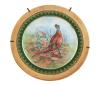 <span class='ref_item'>81 -</span> <span class="object_title">PLATO DECORATIVO EN PORCELANA DE LIMOGES, FRANCIA, S.XX</span>   <p><span class="technical_description">Plato realizado en porcelana de Limoges, decorado con una pareja de perdices y decoraciones de filigrana en oro de 24kt en bordes. Escena realizada por impresión y finalizada a mano. Sello de fabricación de Limoges en parte trasera e inscripción "Rehausse Main" (destacado / completado a mano). Con soporte metálico para exhibirlo. Medidas: 24 cm de diámetro</span><br></p>