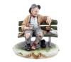 <span class='ref_item'>83 -</span> <span class="object_title">FIGURA EN PORCELANA CAPODIMONTE</span>   <p><span class="author">Bruno MERLI (XX)</span> <br><span class="technical_description">Figura realizada por Bruno Merli en porcelana de Capodimonte que representa a un vagabundo anciano sentado en un banco dando de comer a las palomas. La figura tiene el sello de Capodimonte y la firma del autor en el borde lateral-trasero.<br/>Medidas: 23 x 23 x 18.5cm</span><br></p>