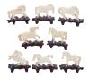 <span class='ref_item'>128 -</span> <span class="object_title">LOTE DE 8 FIGURAS DE CABALLOS TALLADAS EN MARFIL SOBRE UNA BASE DE MADERA.</span>   <p><span class="technical_description">Lote formado por 8 figuras de caballos talladas en marfil, en distintas poses, sobre bases de madera oscura. Algunas presentan pequeños desperfectos.<br/>Medidas aprox: 8 x 9cm</span><br></p>