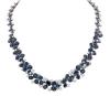 <span class='ref_item'>50 -</span> <span class="object_title">GARGANTILLA EN ORO DE 18 KT. CON ZAFIROS Y DIAMANTES</span>  <p><span class="technical_description">Gargantilla realizada en oro de 18 kt. De diseño floral con parte central más ancha y más estrecha hacia los lados, esta formada por 71 zafiros en talla oval con peso total aprox. 52 ct. adornados por diamantes en talla brillante con peso total aprox. 12.60 ct.<br/>Cierre: Caja con lengüeta, sistema de seguridad y cadena de seguridad. Longitud: 40 ct</span><br>Peso: <span class="PESO_HCES1">75,30</span> <span class="PESOUMED_HCES1">gr.</span><br></p>