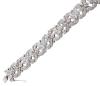 <span class='ref_item'>74 -</span> <span class="object_title">PULSERA ESTILO ART DÉCO EN ORO DE 18 KT. Y PLATINO CON DIAMANTES</span>  <p><span class="technical_description">Pulsera brazalete realizada en oro de 14 kt. Platino estilo Art Déco con diseño articulado de motivos vegetales adornados por diamantes en tallas antiguas : Rosa doble y 8/8 engastadas en grano y en garra con peso total aprox. 3.5ct.<br/>Cierre: Caja con lengüeta y cadena de seguridad. Medidas: 18 cm de longitud x 2 cm de ancho</span><br>Peso: <span class="PESO_HCES1">64,80</span> <span class="PESOUMED_HCES1">gr.</span><br></p>