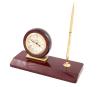 <span class='ref_item'>121 -</span> <span class="object_title">RELOJ DE SOBREMESA TIPO ESCRIBANÍA, MARCA FESTINA</span>   <p><span class="technical_description">Elegante reloj de sobremesa tipo Escribanía de la marca FESTINA con base de madera en acabado de caoba y detalles dorados.<br/>En el centro destaca un reloj esférico de cuarzo con un dial con números romanos. En uno de los lados, incorpora un estilizado bolígrafo dorado.<br/>En funcionamiento.<br/>Medidas: 21.5 x 22.5 x 9cm.</span><br></p>