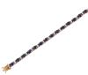 <span class='ref_item'>63 -</span> <span class="object_title">PULSERA EN ORO BICOLOR DE 18 KT. CON ZAFIROS Y DIAMANTES</span>  <p><span class="technical_description">Pulsera realizada en oro bicolor de 18 kt. articulada y compuesta por tallas ovales de zafiros engastados en garras con peso total aprox.5.50 ct. intercalados con pares de diamantes en talla brillante también en garra y peso total aprox .0.50 ct.<br/>Cierre: Caja con lengüeta y doble ocho de seguridad. Longitud: 17,50 cm</span><br>Peso: <span class="PESO_HCES1">11,80</span> <span class="PESOUMED_HCES1">gr.</span><br></p>