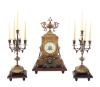 <span class='ref_item'>94 -</span> <span class="object_title">GUARNICIÓN DE RELOJ DE SOBREMESA Y DOS CANDELABROS EN BRONCE SOBRE BASE DE MADERA. ESTILO NAPOLEÓN III</span>   <p><span class="technical_description">Reloj con maquinaría de la firma Samuel Marti. Con inscripción 'medaille de bronze' en la maquinaria junto a la firma. La caja cuadrangular está decorada con relieves de motivos florales y guirnaldas y rematado en su parte superior por un copete en forma de urna decorativa flanqueada por volutas caladas. En los laterales cuenta con manijas en forma de cabeza de león que sostienen argollas. El reloj cuenta con una esfera circular esmaltada en tono crema, con dos bocallaves, protegida por cristal. Con numeración arábiga para las horas y agujas tipo Luis XVI en metal. <br/>Con sonería para las horas y las medias. Acompaña llave para darle cuerda. EN FUNCIONAMIENTO.<br/>El reloj está fijado sobre una base de madera. Lo acompañan 2 candelabros de 5 brazos cada uno con sus velas. Realizados en bronce y colocados también sobre base de madera. Las bases con pequeñas faltas.<br/>Medidas reloj con base: 50 x 30 x 20.5cm  Medidas candelabros: 40cm altura</span><br></p>