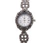 <span class='ref_item'>164 -</span> <span class="object_title">RELOJ DE PULSERA PARA SRA. EN PLATA DE LEY 925 CON MARCASITAS .MECANISMO DE CUARZO</span>  <p><span class="technical_description">Reloj vintage realizado en plata de ley 925. Caja y brazalete integrado adornados por marcasitas. La caja con forma circular, esfera de fondo gris con números romanos esta adornada por bisel de marcsitas. El brazalete con eslabones en forma de flor también adornados por marcasitas. Mecanismo de cuarzo. En estado de marcha<br/>Cierre de pestaña. Longitud: 17 cm</span><br>Peso: <span class="PESO_HCES1">33,40</span> <span class="PESOUMED_HCES1">gr.</span><br></p>