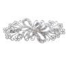 <span class='ref_item'>192 -</span> <span class="object_title">GRAN BROCHE CON FORMA DE LAZO CALADO Y ADORNADO POR CIRCONITAS</span>  <p><span class="technical_description">Gran broche de metal con forma de lazo calado adornado en sus bandas y detalles por circonitas. Medidas: 11,5 cm x 4,5 cm<br/>Cierre: Aguja con mecanismo de seguridad</span><br>Peso: <span class="PESO_HCES1">57,60</span> <span class="PESOUMED_HCES1">gr.</span><br></p>